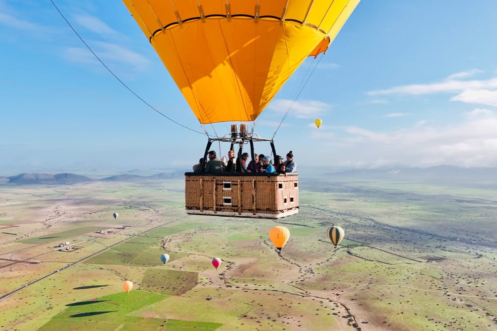 Hot air balloon at sunrise over the Agafay plateau near Marrakech