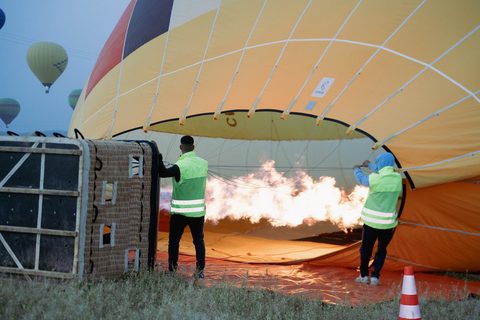 Inflating the balloon with the burner before take-off near Marrakech